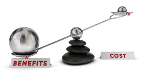 Two spheres with different sizes on a seesaw plus two signs cost and benefits over white background marketing analysis concept or symbol